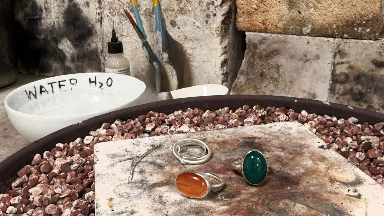 Pietra Viva handmade rings on natural stone background